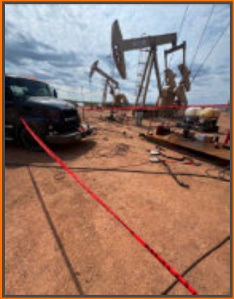 Hydrotesting equipment staged on an oilfield location